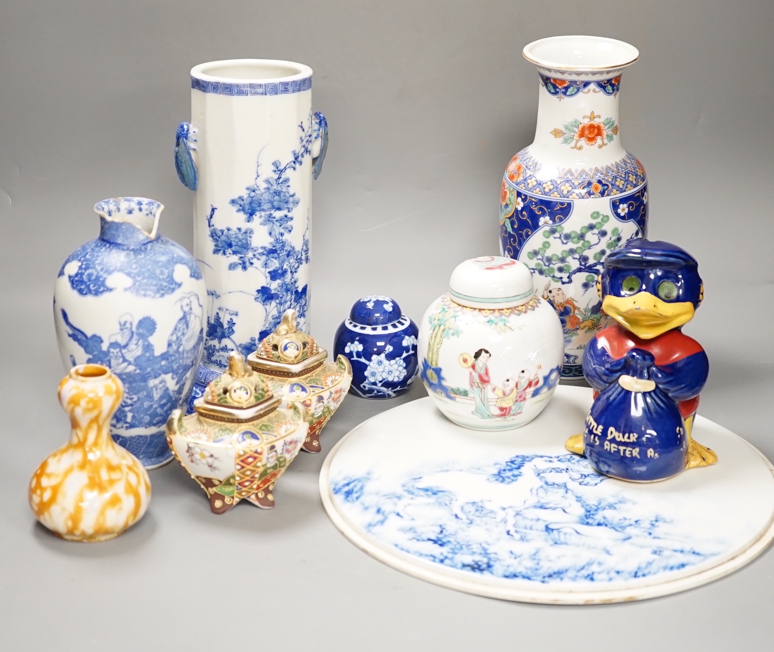 A group of 20th century Chinese and Japanese ceramics, including a blue and white circular plaque, 31 cm diameter